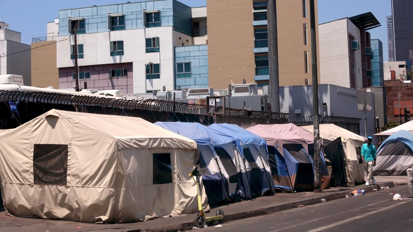 LOS ANGELES,  CA – JUNE 28, 2024 – Tents line up in a row along 5th Street where homeless live in Skid Row in downtown Los Angeles on June 28, 2024. (Genaro Molina/Los Angeles Times via Getty Images)